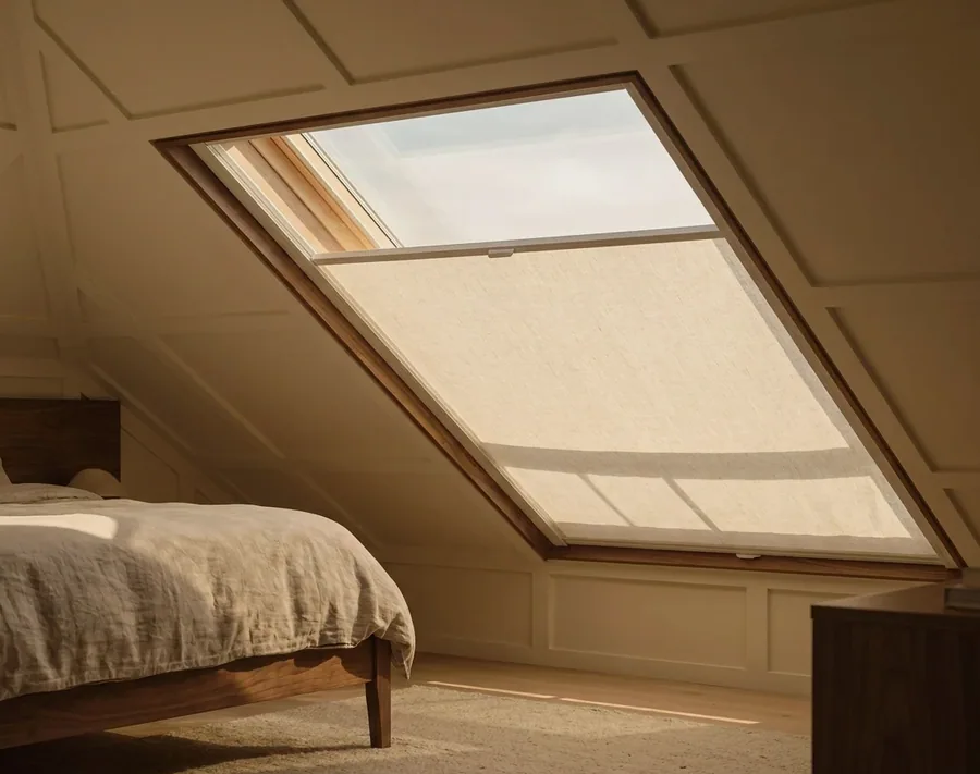 Pleated blind fitted to an angled skylight window above a Beaulieu attic bedroom